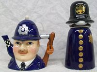 Front view of Sadler policeman teapot and Webco ceramic stein showing detailed facial features and painted accents