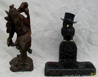 Front view showing both carved figures, the Asian rosewood figure on left and German ebony owl on right.