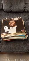 Stack of over 40 vinyl LP records including one with Luciano Pavarotti on the cover.