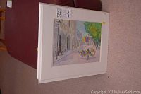 Stack of six matted watercolour prints by Robert Allen showing landscape scenes including a street with balloon vendors and a river waterfall.