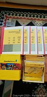 Five Rosetta Stone Spanish course software boxed sets laying flat showing covers and discs