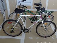 Front and side full view of the white Challenger Supercycle 10-speed bicycle, showing the frame, wheels, seat, and handlebar.