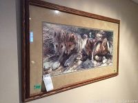 Full front view of framed print mounted on wall against beige background