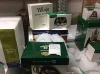 Multiple boxed Department 56 Dickens’ Village pieces including Canadian Pub and Abbey Lane Chocolates
