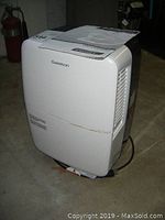White Garrison dehumidifier full view showing portable design and cord