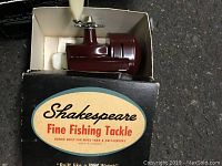 Maroon Shakespeare Fine Fishing Tackle reel in original box