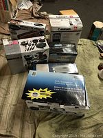Overview of all six boxed kitchen items on bedspread