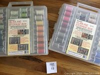 Two Universal Slimline Storage Boxes with Sulky Blendables Dream Package threads in various colors arranged inside, both boxes unopened with labels attached.