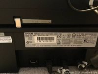 Rear panel label showing model number, serial number, power and USB ports