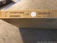 Box for IKEA Svartåsen laptop stand with model number and dimensions visible.