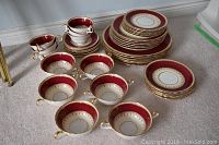 Overview of all dinnerware pieces arranged on carpet