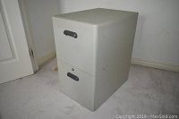 Front view of Rubbermaid two drawer file cabinet showing overall condition and drawer handles