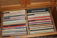 Two drawers filled with organized vinyl 33 RPM records, showing album covers densely packed vertically