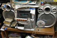 Front view of JVC stereo system with speakers and accessories