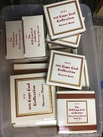 Boxes showing Avon 1876 Cape Cod dessert bowls, dessert plates, bread and butter dishes