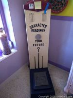 Full-length frontal view of the novelty weight scale showing white panel, stenciled text, and footplate