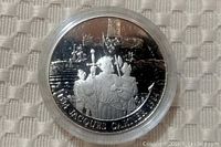 Obverse of coin showing Jacques Cartier and crew with ships, inscription 'JACQUES CARTIER 1534-1984'