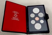 Opened case showing seven Canadian proof coins including special silver dollar