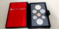 Full view of the closed case showing the red Royal Canadian Mint cover.