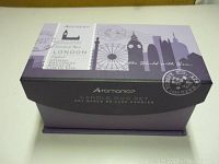 Closed purple gift box showing London-themed graphics and branding for Aromance Candle Duo Set.
