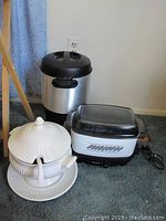 Wide view of Hamilton Beach coffee pot, Westbend crock pot, and ceramic soup tureen showing all three items together