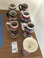 Photo of six colorful Budweiser holiday steins with farm holiday designs and one stein bottom label showing 1998 Farm Holiday.