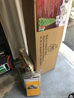 Boxed GE artificial Christmas tree labeled #90 tree featuring 200 GE LED lights and 600 incandescent lights, energy smart with flame retardant branch tips.