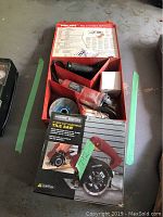 Hilti HG450 mini grinder and Chicago Electric tile saw box side by side