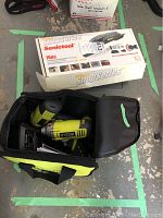 Ryobi impact driver inside soft carrying bag with Rockwell Sonictool 16 pc set box