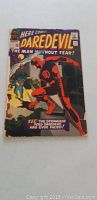 Front cover showing Daredevil in red costume with action scene, the title, issue number and Marvel Comics logo visible. Condition shows wear with splitting along the spine and corner wear.