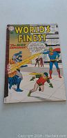 Front cover of vintage World's Finest comic book issue #105 with Superman and Robin artwork and 10 cent price.