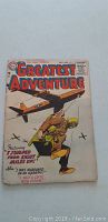 Front cover of My Greatest Adventure #4 comic book showing soldier carrying a wounded man with airplane in background.