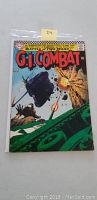 Front cover showing the G.I. Combat comic book with action-packed tank warfare scene and 12 cent price.