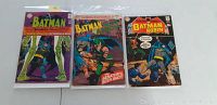 Front cover of three vintage DC comic books in protective sleeves showing Batman, Brave and the Bold, and Detective Comics titles