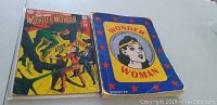 Front covers of the two Wonder Woman comic books, showing the detailed artwork and overall condition of each item.