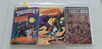 Front covers of three comic books: Thunder Agents #9 and #10 (1966) and The World Around Us #26 (1960)