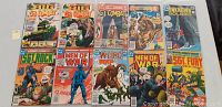 Top side front view of the ten DC war comics, showing colorful covers featuring military and combat scenes. Titles include Big G.I. Combat, Unknown Soldier, Sgt Rock, Men of War, Weird War, and Sgt Fury. Shows general wear and condition issues.