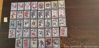 Photo showing 38 O-Pee Chee hockey rookie cards arranged in rows, featuring multiple known players.