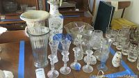Photo of Lenox crystal candlesticks and various glass vases on a table