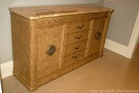 Front three-quarter view of credenza showing overall shape, finish and hardware
