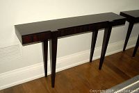 Front view showing both console tables against wall