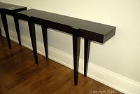 Angled front view of console table showing full length and modular segments