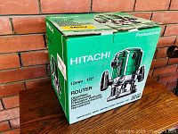 Closed green Hitachi box showing front artwork and branding