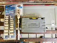 Full view of the closed Mastercraft Maximum tool kit in gray case and new packaged extendable ratchet & socket set