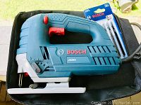 Bosch JS260 top handle jigsaw on black carrying bag