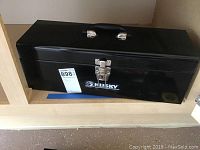 Closed black Husky metal tool box with handle and latch, labeled with lot number 898.