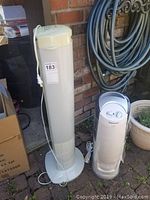 Side view of the Seville tower fan and Honeywell Quiet Care humidifier showing their relative height and design features.