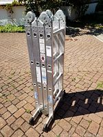 Ladder folded into compact position showing non-slip feet and side rail profiles