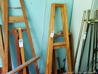 Two wooden easel frames side by side showing their structure and finish.