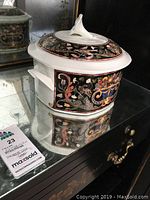 Porcelain casserole dish with lid and ornate Intarsia pattern from Villeroy & Boch Chateau Collection, shown on mirrored surface